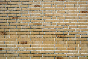 Background from a wall made of beige clinker bricks