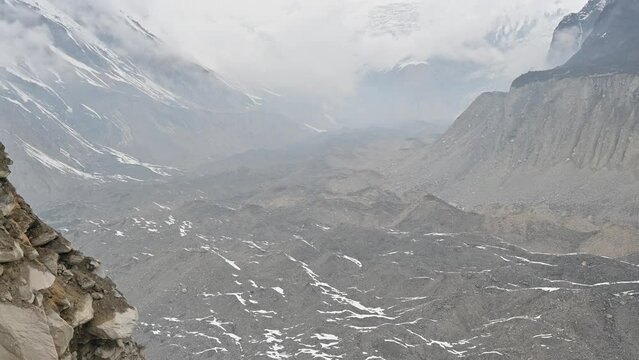 View of south Annapurna glacier under moraine rocks, this glacier feeds the drainage of the Modi Khola river.