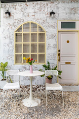 Vase with beautiful flowers on table in outdoor