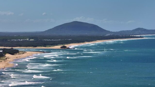 Blue Ocean Waves And Sandy Shore Coast Overlooking Mount Coolum Mountain, 4K Aerial Drone Australia Telephoto