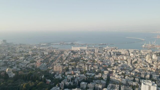 Amazing view of bahai gardens and surrounding cityscape. Mediterranean in background