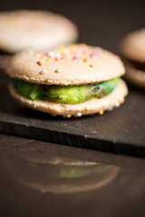 Delicious French sweet vanilla macaron with a velvet rainbow ganache.