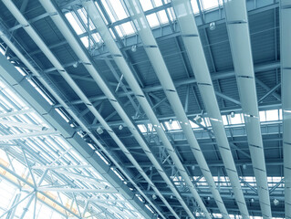 Lights and ventilation system in long line on ceiling of the  industrial building. Exhibition Hall. Ceiling factory construction