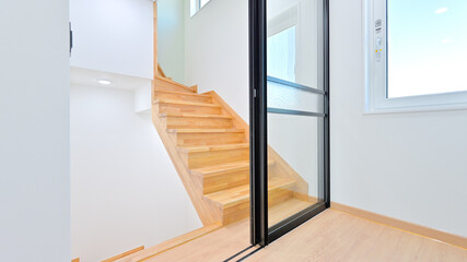 A glass door is installed between the 1st and 2nd floors to protect privacy between parents and children