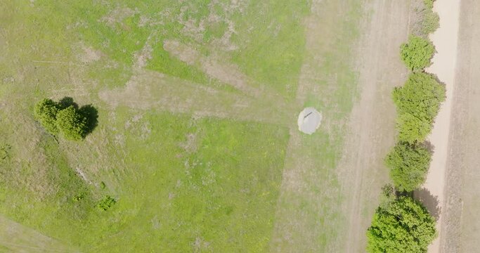 Aerial Topdown On Outdoor Shooting Range With Post Standing In Leach, Oklahoma. descending tilt-up