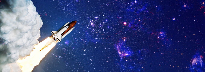 Shuttle launch in the clouds to outer space. Dark space with stars on background.Spaceship flight....