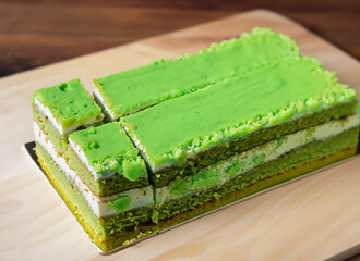 Green birthday cake with green candles