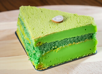 Green birthday cake with green candles