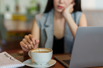 Close-up hand using coffee stirrer people go back forth like people who are having hard time,...