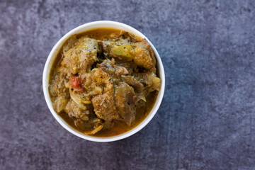 A traditional duck curry roast. Kerala style duck or chicken curry with coconut milk for appam rice. Indian food in black background. 