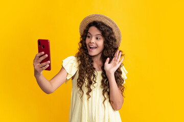 Happy teenager girl 12, 13, 14 years old with smart phone. Hipster teen girl types message on cellphone, enjoys mobile app. Kid hold smartphone texting in online social media. Internet addiction.