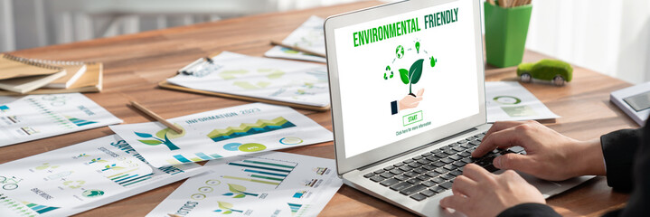 Businessman in green corporate company planning eco-friendly and environmental conservative to...