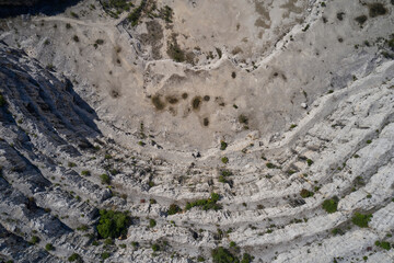 Old marble quarry steps top view. Large marble quarry. Open mining marble in a quarry.