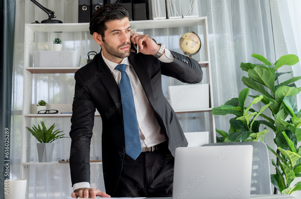Aufkleber diligent businessman busy talking on the phone call with clients while working with laptop in his of