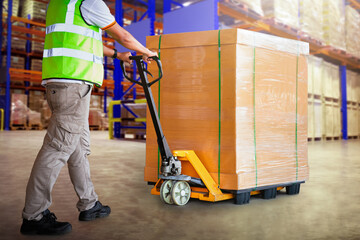 Workers Unloading Heavy Package Boxes in Storage Warehouse. Forklift Pallet Jack Loader. Shipping...