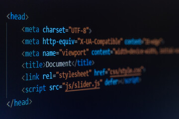 computer code written on a monitor in HTML language