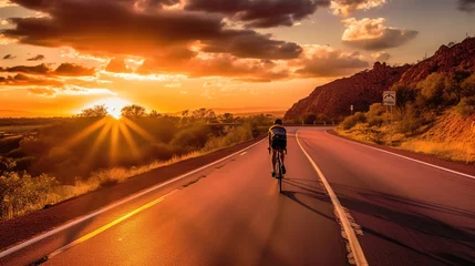 Abwaschbare Fototapete Rot  violett Cyclists practice cycling on open road to sunset