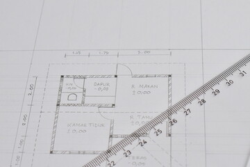 Architect engineer contractor design working drawing sketch plan blueprint and making architectural construction house building in architect studio.