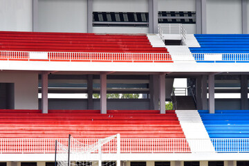 Rows of tribun for fans at empty large football stadium