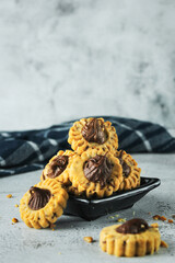 cookies with choco on topping. traditional cake in Indonesia. served in grey and texture background