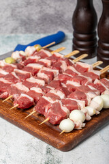 Lamb skewered meat. Barbecue meat made from lamb leg on a wooden presentation board