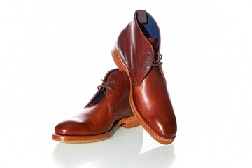 Footwear Concepts. Premium Tanned Derby Boots Made of Calf Leather with Leather Sole Placed On One Another On Pure White Background.
