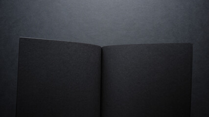 dark background book spread with black pages