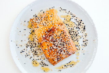 Feta cheese wrapped in crispy phyllo with sweet honey sauce and sesame seeds. Local Greek meze...