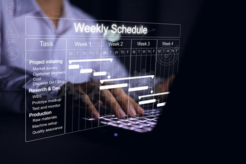 Businessman working with project management schedule plan for product production or Research and...