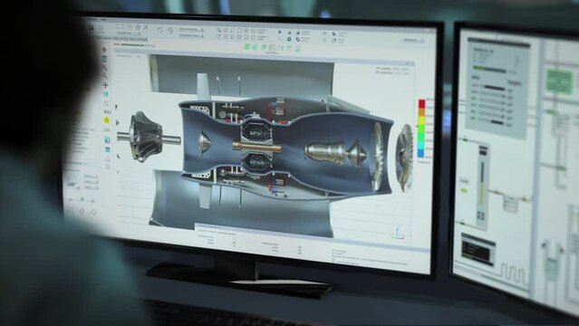 High tech software creating a projection of the heavy industrial machine. High tech software used for the 3D parts design project. High tech software displaying the project of machine details.