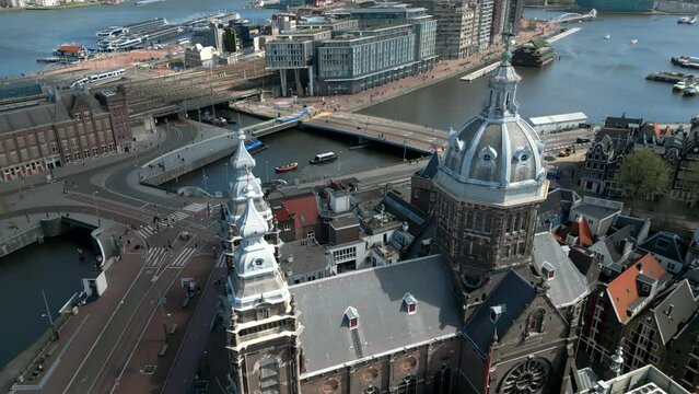 Drone footage in Amsterdam, Netherlands. Domes of the monastery. Central station, river canals. High quality 4k footage