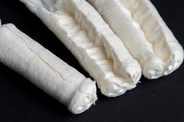 Sewn cotton wool for use as tampons