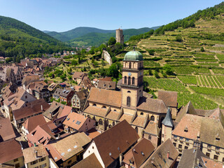 Obraz premium Aerial Drone Shot of the village of Kaysersberg in Alsace in a day. Summer in France, Church Castle and a beautiful City