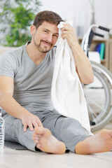 muscular man relaxing in modern gym