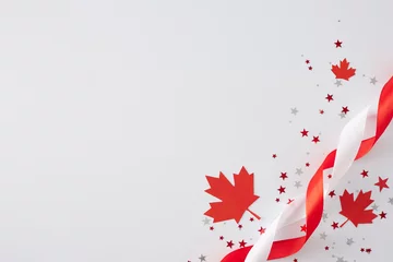 Keuken foto achterwand Canada Victoria Day festivities concept in Canada. Top view flat lay of red maple leaves, stars confetti, satin ribbons on white background with empty space for text or greeting