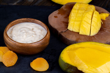 fresh milk yogurt with mango slices, bio yogurt