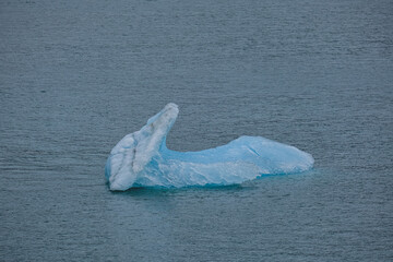 Cruise to Hubbard Glacier Bay in Alaska with floating ice bergs and drift ice floes on ocean water...
