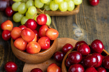Naklejka na ściany i meble Sweet fresh cherries with other products