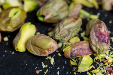 Crispy delicious pistachios with salt on the table