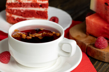 Red raspberry tea with pieces of fruit and berries