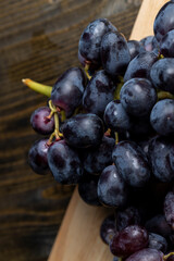 Ripe fresh grapes on a board