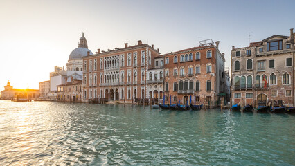 The Grand Canal in Venice with the Santa Maria della Salute basilica at a beautiful sunrise, Italy, Europe.