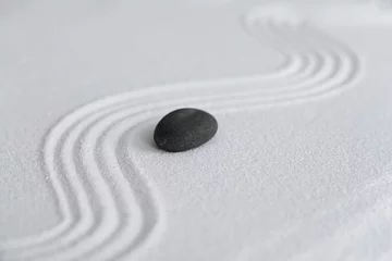 Foto auf Acrylglas Zen Garden with Grey stone on White Sand Wave Pattern in Japanese stye, Rock Sea Stone on Sand texture with the wave parallel lines pattern,Harmony,Meditation,Zen like concept © Anchalee