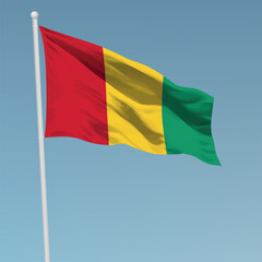 Waving flag of Guinea on flagpole. Template for independence day