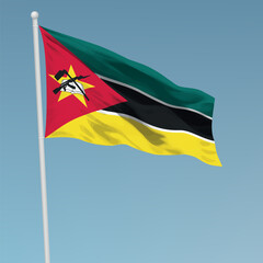 Waving flag of Mozambique on flagpole. Template for independence day