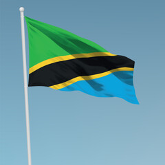 Waving flag of Tanzania on flagpole. Template for independence day