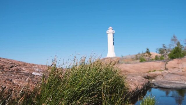 Sea lighthouse on a rocky shore