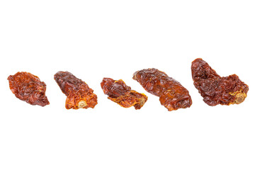 Dried or Sundried tomato halves. Sun-dried tomatoes isolated on white background. With clipping path. Full depth of field. Focus stacking