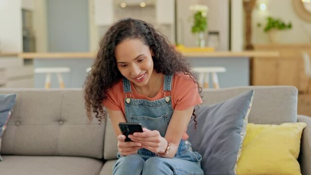 Phone, funny and woman on sofa for online communication. internet meme and social media in home living room. Happy, laugh and african person on mobile for web chat, news or networking in apartment