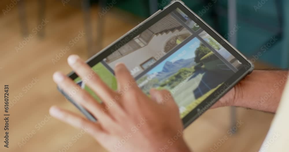 Poster hands of biracial man using tablet with home security camera views on screen, slow motion